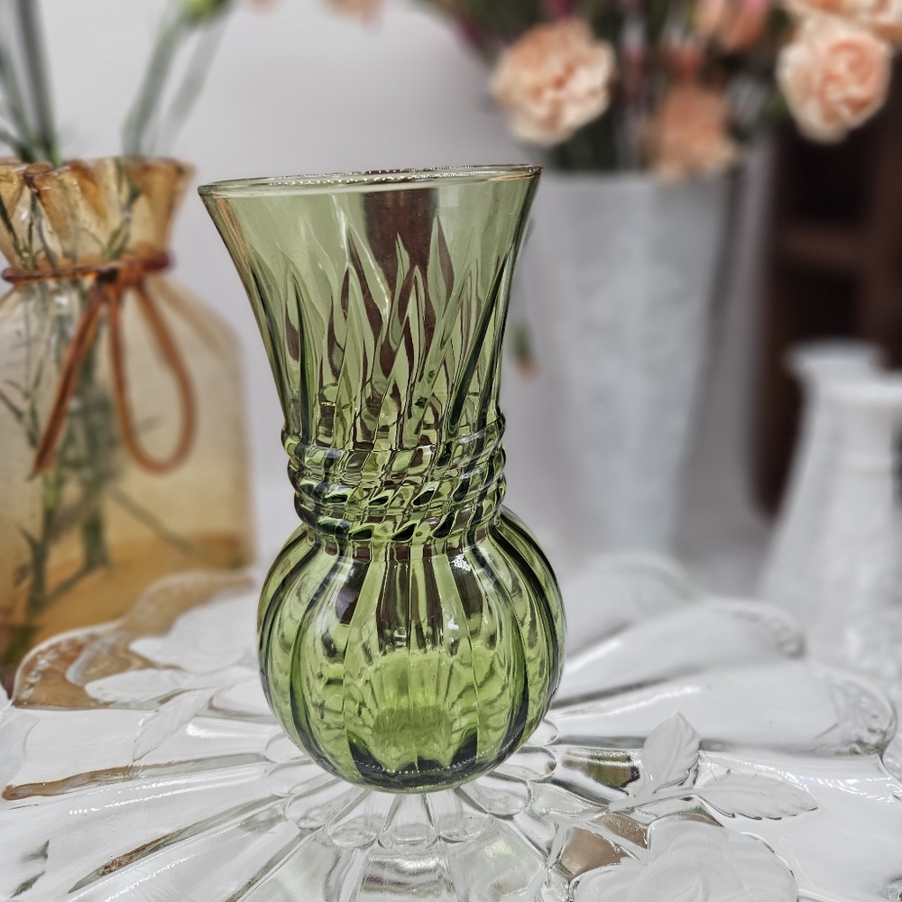 Green vase with rope detail